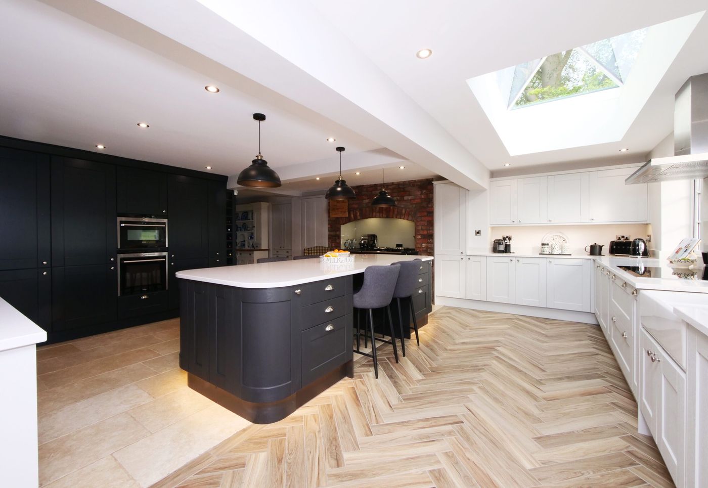 Open plan kitchen with pyramidal roof lights